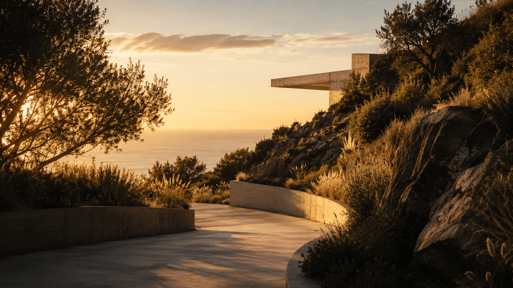 The private access road cut into the Point Dume hillside at dusk